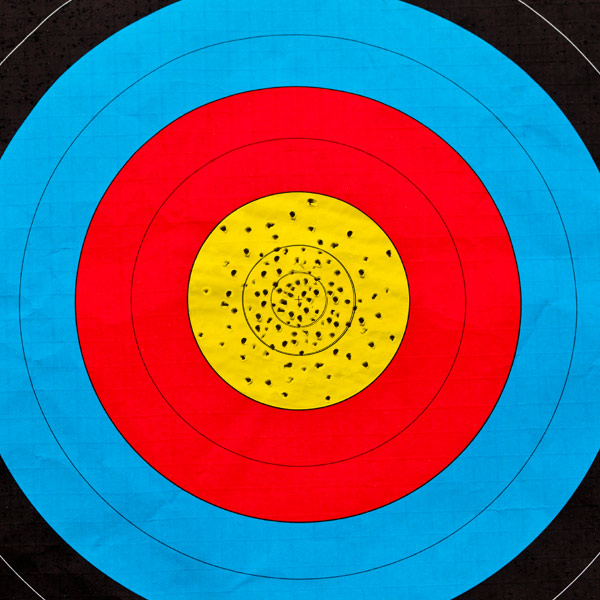 Target with bulls eye with many hits