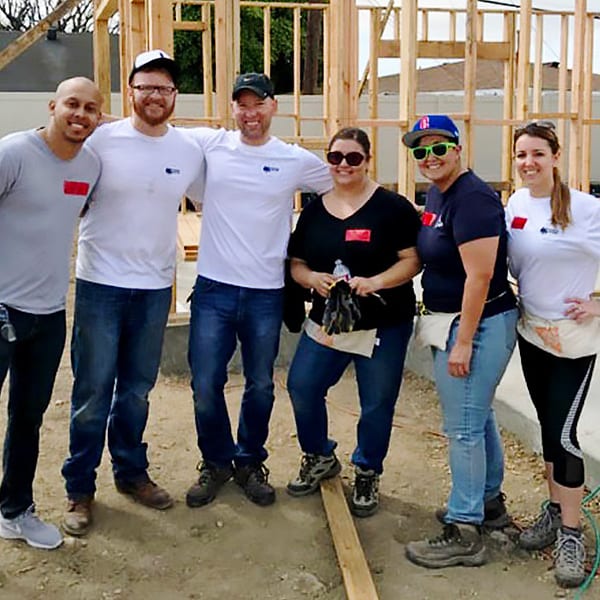 Branded Group's management team working on a habitat for humanity project.
