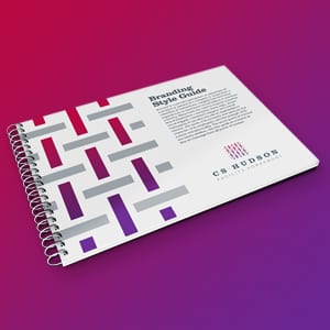 Brand guidelines for CS Hudson shown on a spiral bound book.